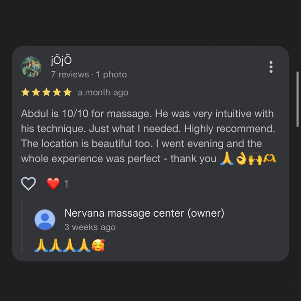 Customer review for a massage center with text and emojis on a dark background